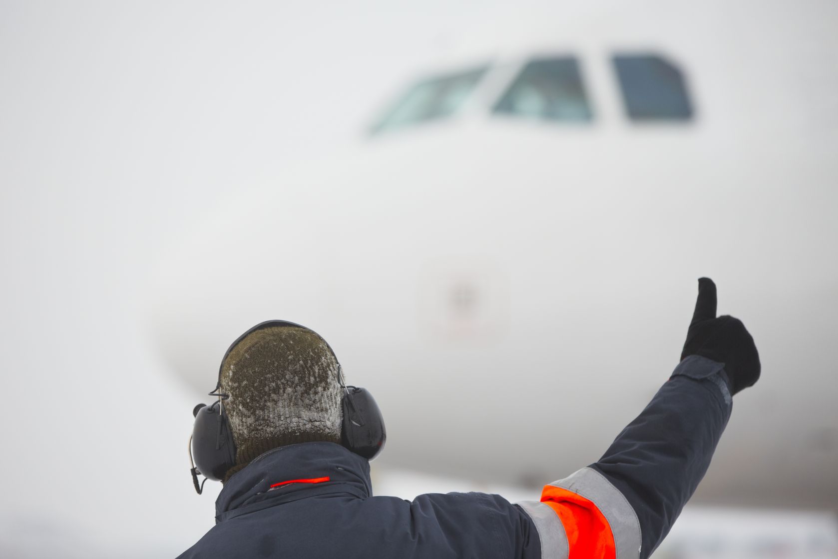 17170061 - member of ground crew is showing ok sign to pilot